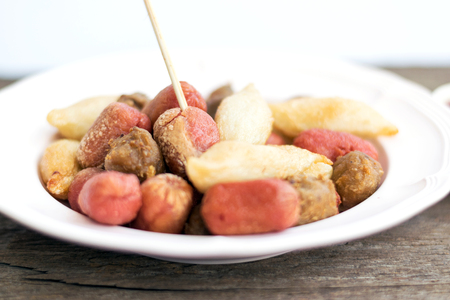 Fried meatballs in the dish on wooden background.の写真素材