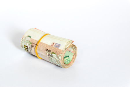 A row of Thailand's Baht isolated on white background.の写真素材