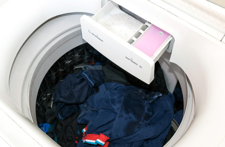 Detergent and fabric softener in the washing machine.の写真素材