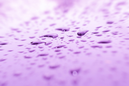 Beautiful rain drops on a car roof.の写真素材