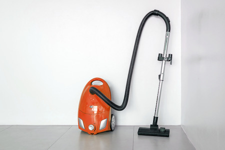 Colorful of electric vacuum cleaner in the white room.の写真素材