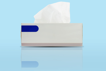 Box of tissues with shadow isolated on blue background.の写真素材