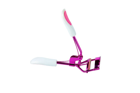 Colorful eyelash curler isolated on white background.の写真素材