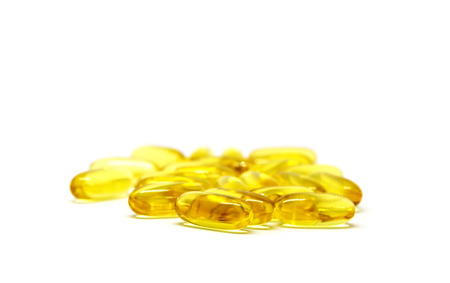 Closeup group of vitamin tablets on white background.の写真素材