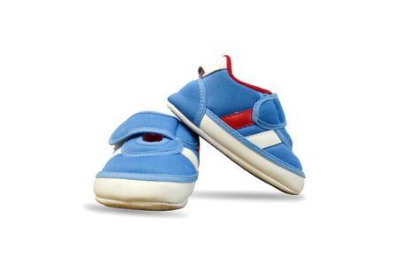 Closeup beautiful design of baby shoes isolated on white background.の写真素材