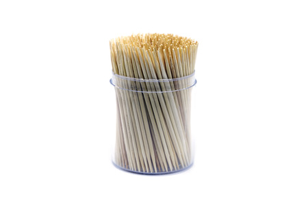 Closeup group of wooden toothpicks in the box isolated on white background.の写真素材