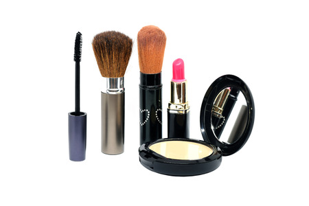 Closeup group of makeup cosmetics on white background.の写真素材