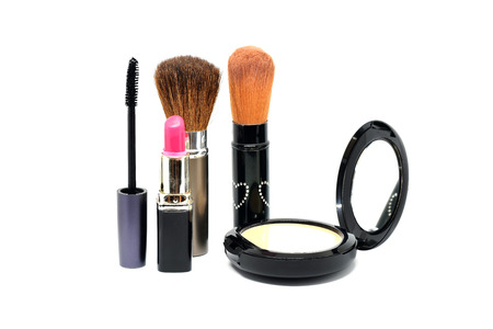 Closeup group of makeup cosmetics on white background.の写真素材