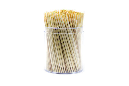 Closeup group of wooden toothpicks in the box isolated on white background.の写真素材