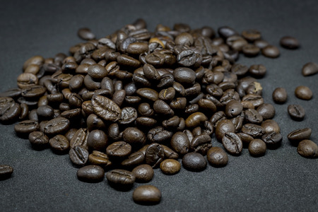 Closeup group of coffee beans  on the dark background.の写真素材
