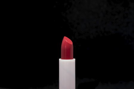 Closeup colorful lipstick isolated on black background.の写真素材