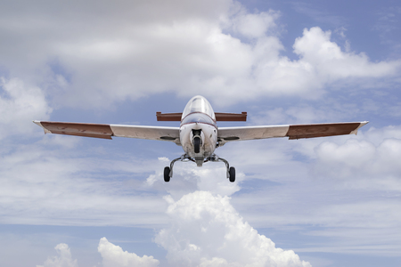 Closeup vintage aircraft flying on the sky.の写真素材