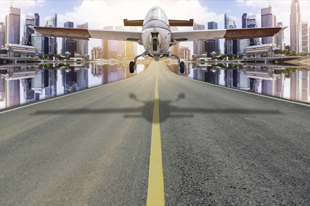 The vintage aircraft was to land on the road in the city.の写真素材