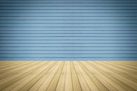 Beautiful wooden floor with a blue wooden wall background.の写真素材
