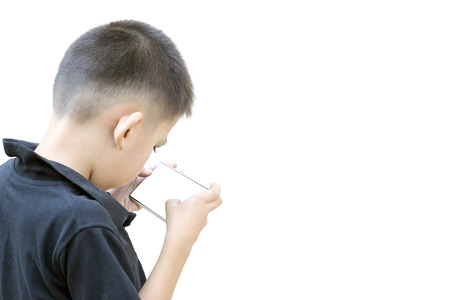 The boys are playing games on smartphones over white background.の写真素材