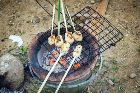 Sticky rice toast with fire from the stove.の写真素材