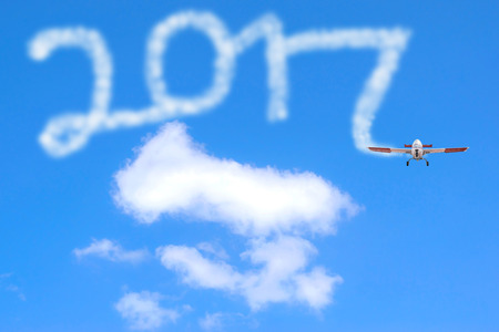 2017 figures news year drawing by airplane in the sky.の写真素材