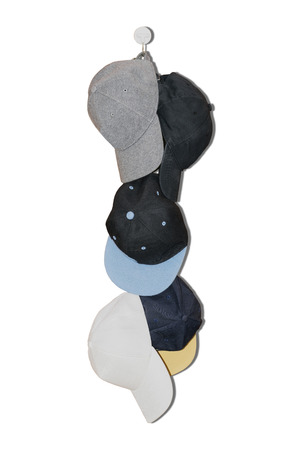 Group of the colorful fashion caps isolated on white background.の写真素材