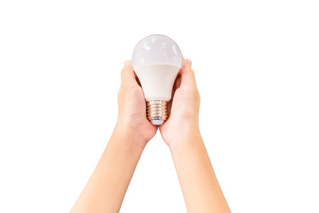 Closeup LED lighting bulb in hands isolated on white background, Concept for energy saving.の写真素材