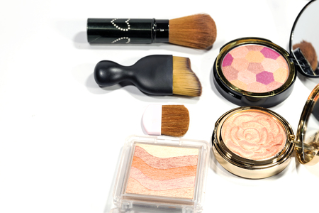 Closeup beauty powder cosmetics and brush isolated on white background.の写真素材