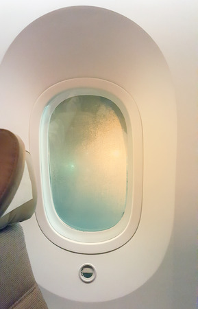 Closeup the windows and mirrors on passenger aircraft.の写真素材