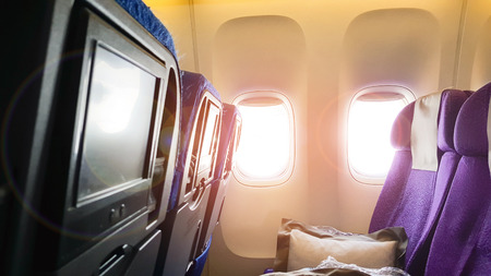 The light of the sun peeking into the window of the plane.の写真素材