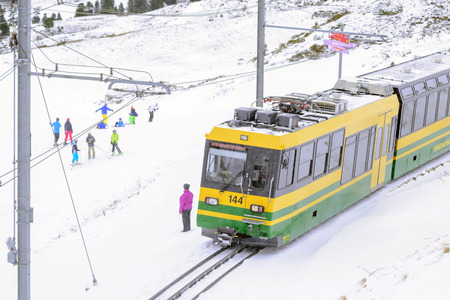 Jungfrau,Switzerland-Jan 4,2017: Scenic railway to Klein's Scheidegg mountain pass, a famous ski resort area, to admire the passing scenic valleys and the Glacier Falls.のeditorial素材