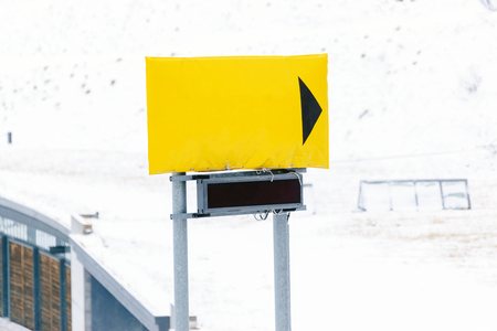Closeup the yellow signs blank on the mountain with backdrop is snow.の写真素材