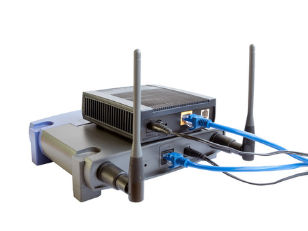 Internet router and wireless access point with cable isolated on white background.の写真素材