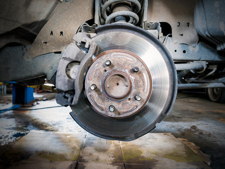 Closeup disc brake of the vehicle for repair.の写真素材
