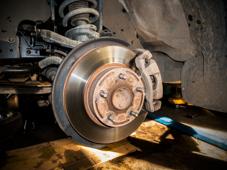 Closeup disc brake of the vehicle for repair.の写真素材
