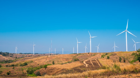 Wind turbine for electricity production on the mountains and beautiful sky.の写真素材