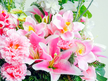 Closeup group of beautiful plastic flowers.の写真素材