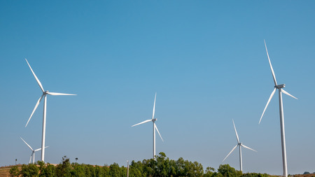 Wind turbine for electricity production on the mountains and beautiful sky.の写真素材