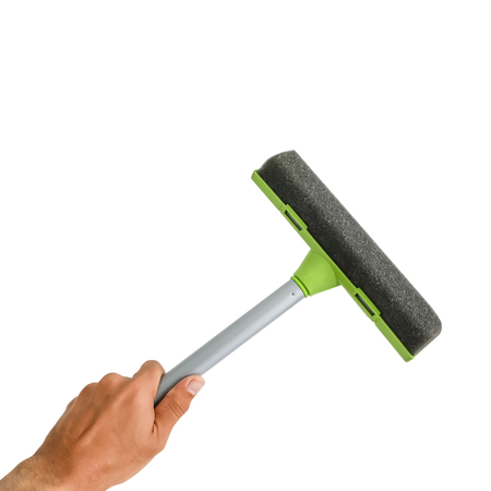 Glass cleaner tool in hand isolated on white background with clipping path.