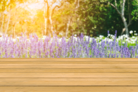 Top of the wood table on blur lavender flowers garden background-can use for display or put your products and some food.の写真素材
