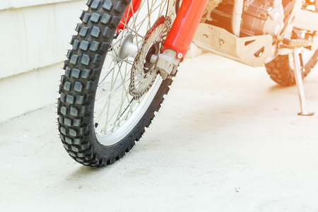 Closeup a brake discs in front of a motorcycle.