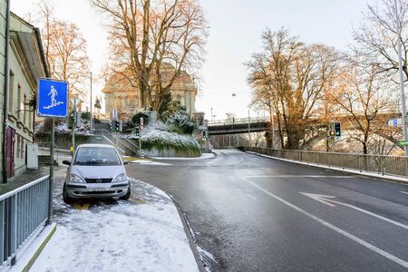 Bern, Switzerland-Jan 3, 2017: The road is empty and snow covered in winter in Bern city, Switzerland.のeditorial素材