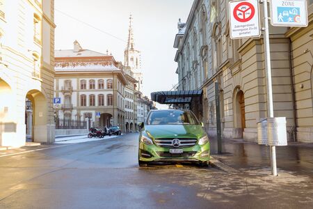 Bern, Switzerland-Jan 3, 2017:A green Mercedes is parked on a street in Bern, Switzerland.のeditorial素材