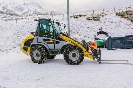 Jungfrau, Switzerland - Jan 4, 2017: Snow Loader require a chain on the wheel to prevent slipping when the car is running on the snow at the Jungfrau mountain in the Alps.のeditorial素材