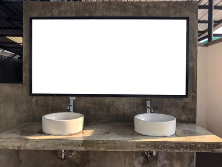 Ceramic basins and mirrors on bare cement are popular public bathroom designs.の写真素材