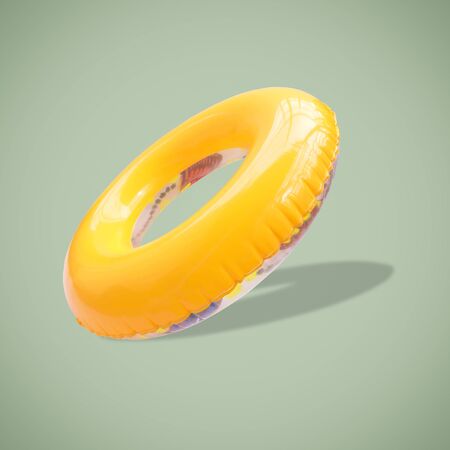 Yellow color swim rings isolated on beautiful pastel color background, with clipping path.の写真素材