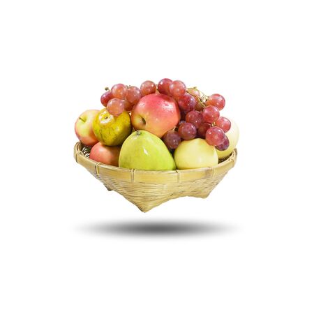 Group of many fruits in a bamboo basket isolated on white background, with  .の写真素材