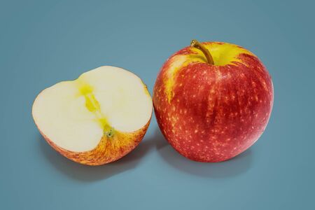 Apples and apples in half isolated on beautiful pastel color background, with clipping path.の写真素材