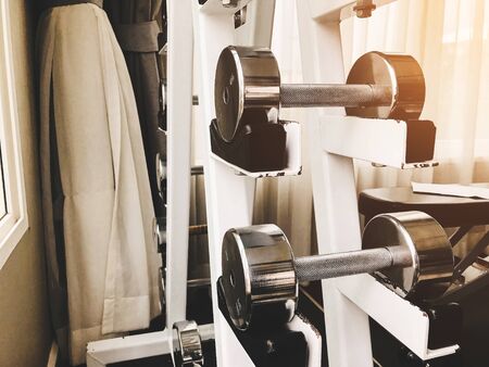 Closeup group of dumbbells different weights for exercising arm muscles in the gym.の写真素材