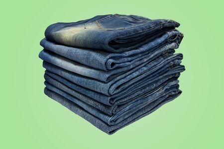 Stack of blue jeans long legs for men and  isolated on pastel color background with  .の写真素材