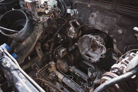 Closeup of the engine compartment of the car with the engine removed for overhaul, transportation and insurance industry concepts.の写真素材