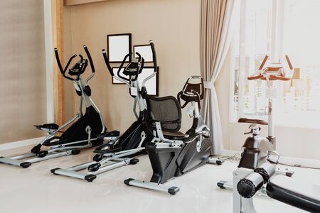 Empty gym or exercise room has many types of equipment but no one uses them, Concept for exercise and health care.の写真素材