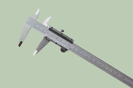 Vernier is a measure of the jobs and the industry is measured in centimeters and inches isolated on pastel color background.の写真素材