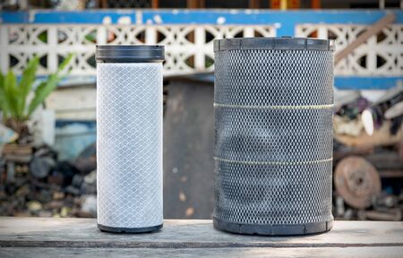 Old truck air filter placed on the wooden table.の写真素材